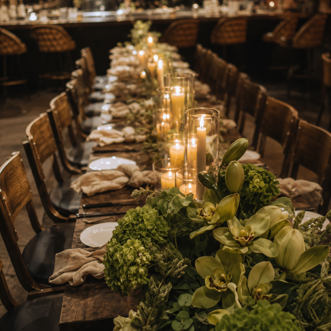 Candlelit tablescape with cymbidium orchids and hydrangea garland